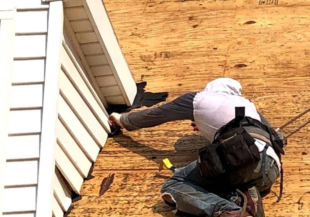Dover PA roofing contractor installing new flashing on this roof replacement by JWE
